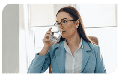 Woman drinking water in glass